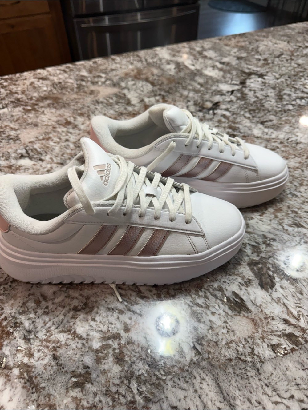 Adidas Platform Women’s White Sneakers with Rose Gold Stripes.